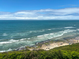 Panoramic view of the coast of Torres city with crowded beach - Praia da Cal - Torres, Brasil	
