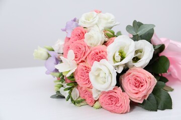 Beautiful wedding bouquet on white table, closeup