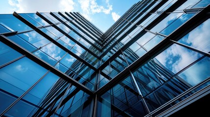 Obraz premium Modern Office Building Exterior with Blue Glass Facades in City Background