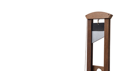 Wooden Guillotine with Angled Steel Blade Isolated on White Background with Copy Space and Clipping...