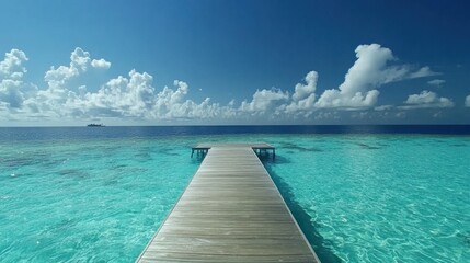 Tranquil Wooden Pier Extending into Turquoise Ocean Paradise