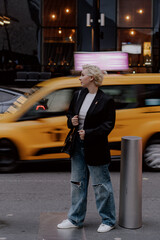 Chic Urban Style featuring a Yellow Taxi enthusiastically in Motion cityscape