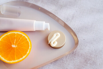Vitamin C face cream with orange fruit slices