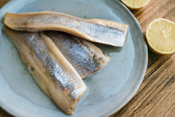 Marinated salted herring fillet in oil