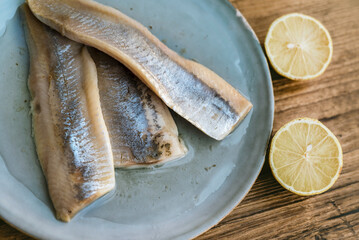 Marinated salted herring fillet in oil