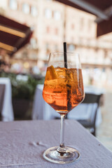 Cocktail aperol spritz on a table in restaurant  in Siena, Italy