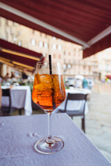 Cocktail aperol spritz on a table in restaurant  in Siena, Italy
