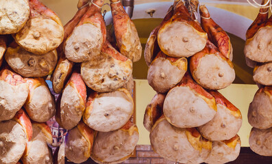Typical Italian cured ham hanging . Prosciutto San Daniele