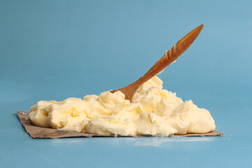 butter with boat on blue background