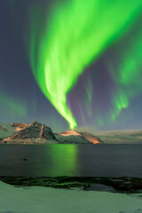 Aurora or nothern lights illuminating the night sky