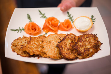 Plate of Potato Pancakes with Smoked Salmon and Sour Cream