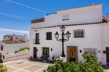 Unique white painted village of Mijas (not far from Malaga) - Spanish hill town overlooking the Costa del Sol. Wonderful decoration of the houses in Mijas. Mijas, Andalusia, Spain.