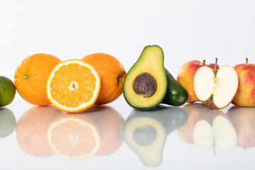 A variety of Fresh Fruits beautifully displayed on a shiny Reflective Surface for photography