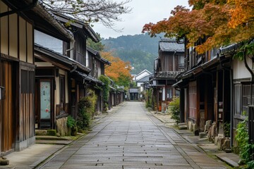 Obraz premium Stone street, traditional houses, autumn leaves, quiet village.