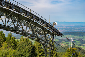 View Over a large deflection pulley of the Schauinsland cable car over Freiburg and the Rhine Valley to the Vosges Mountains