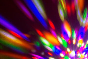 Funky colorful light effect generated by moving disco ball light