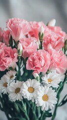 Fototapeta premium Tightly arranged pastel pink carnations and white daisies, creating a textured floral surface, vibrant yet soft hues, cheerful and fresh vibe with natural lighting
