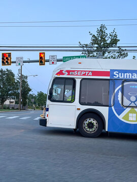 A white and blue bus Septa on the side of it