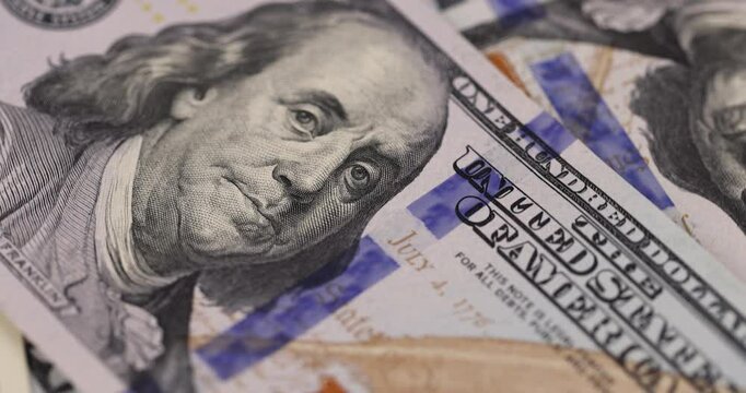 the president for American money with a face value of one hundred dollars, details of new American dollar banknotes for one hundred dollars in close-up