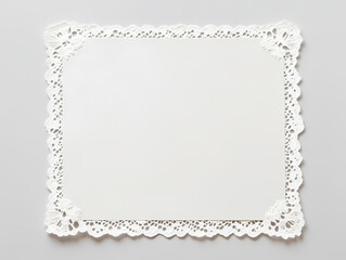 Elegant white paper doily with delicate lace border, perfect for adding a touch of sophistication to any occasion.