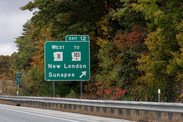 exit sign on Interstate 89 for  Exit 12 for NH-11 and NH-103A toward New London and Sunapee, New Hampshire
