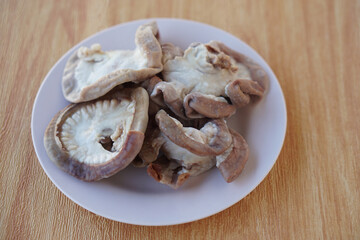 Boiled pork intestines on plate. Concept, street food and weird food that can be cooked for variety delicious menu. Internal organs of pig.  