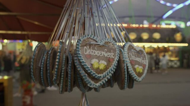 Munich, Germany. Sale of heart shaped gingerbread at Oktoberfest beer festival at Theresienwiese in Munchen, Bayern, Deutschland. Verkauf von Lebkuchen in Herzform auf Oktoberfest. 