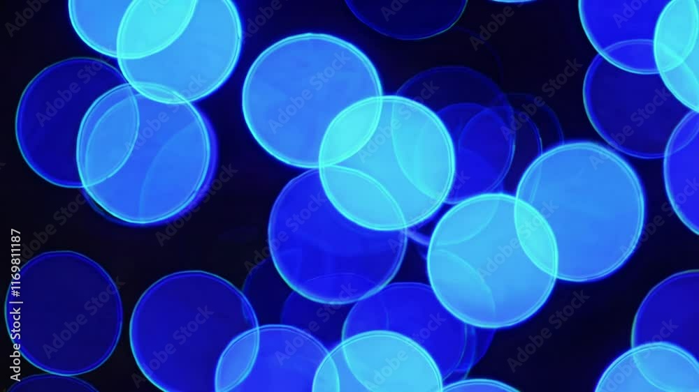Poster Blue bokeh abstract background with circular light patterns