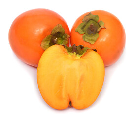 Persimmon whole and half isolated on white background