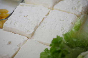 Freshly Cut Tofu Cubes with Crisp Lettuce and Beautiful Garnishes