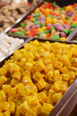Assorted Colorful Turkish Delight Cubes on a White Plate