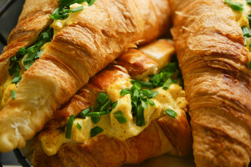 Delicious Savory Croissant Sandwiches Filled with Egg and Fresh Herbs