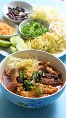 rice vermicelli with northern thai curry sauce on blue background