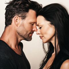 Obraz premium Portraits of mid 40s couple in love. Putting their head together.