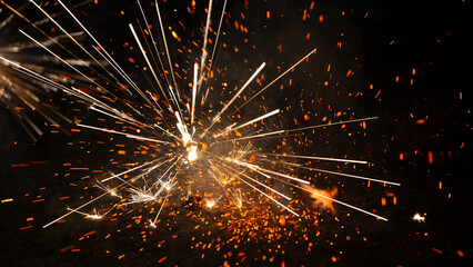 Obraz premium Fireworks and sparks on a black background. Celebration of the New Year and Christmas.