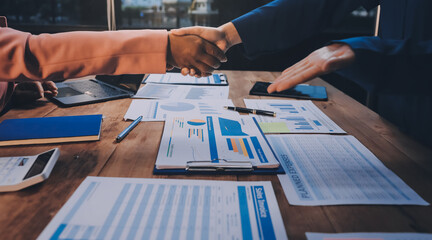 Obraz premium Business handshake for teamwork of business merger and acquisition,successful negotiate,hand shake,two businessman shake hand with partner to celebration partnership and business deal concept