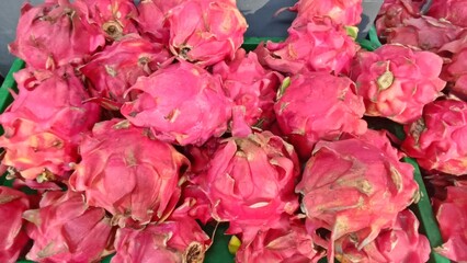 Dragon Fruit Stacked Freshly on Traditional Market Display

