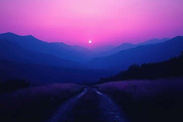Sunset over mountains creates stunning gradient of purple and blue hues in the evening sky
