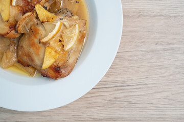 Close up, Baked chicken thighs with pineapple on wood table, Top view