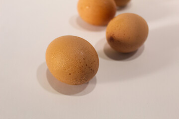 Fresh eggs brownish color isolated on white background