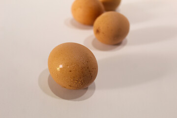 Fresh eggs brownish color isolated on white background