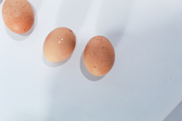 Fresh eggs brownish color isolated on white background