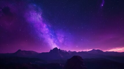 Fototapeta premium Purple Hues Paint the Night Sky: A Breathtaking Milky Way Arches Over a Distant Mountain Range, Creating a Stunning Cosmic Scene.