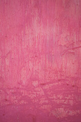 Abstract background wall with pink paint texture surface.