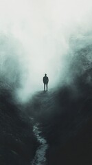 Fototapeta premium Solitude: A Man in a Foggy Landscape
