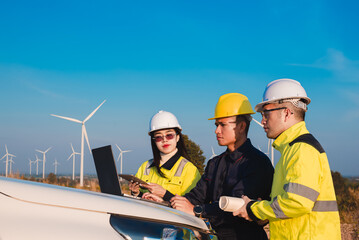 Electrician, architect and engineer are working together to plan the installation and repair of wind turbines to provide sufficient backup power.