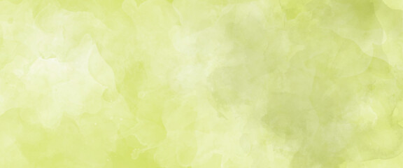 Abstract yellow and green watercolor background texture.