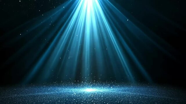 bright blue light shining down with a scattering of blue particles below