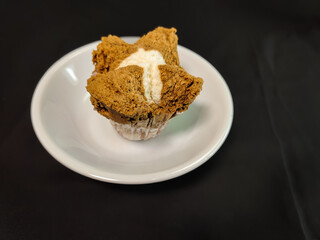 chocolate steamed sponge cake in a small white plate