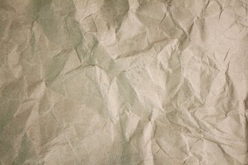 Old crumpled beige paper. crumpled brown paper background. blank brown paper texture background